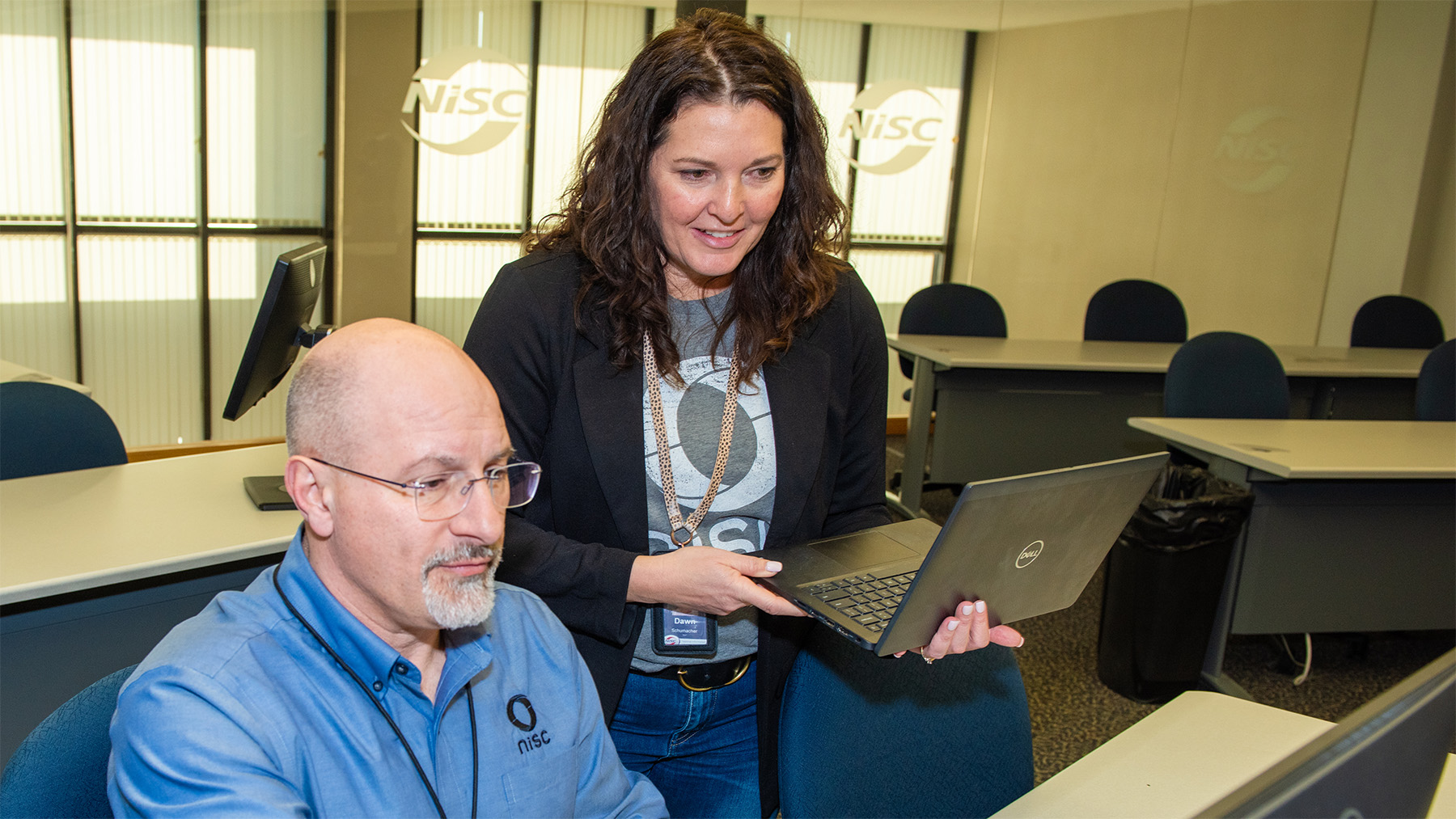 Two employee male and female working on a project at a computer