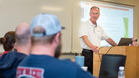 Teacher lecturing at a rural schools institute.