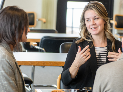 Employees talking in a group.